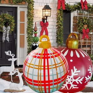 Large PVC inflatable Christmas balls with red patterns on a snowy villa entrance