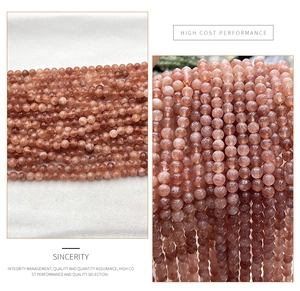 Macro shot of translucent sunstone beads showing internal mineral texture for DIY jewelry