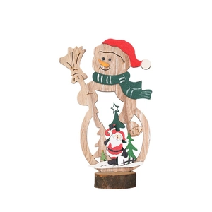Wooden Christmas snowman ornament with Santa scene inside on natural wood base