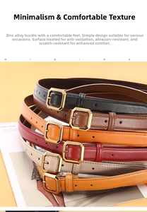 Detail of slim leather belts with gold zinc alloy buckles in multiple colors on a table