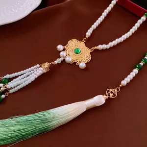 Chinese-style long necklace with pearls, emerald pendant, and green silk tassel decoration