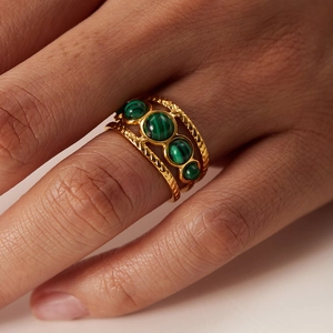 Waterproof gold stainless steel ring featuring green malachite stones and a twisted band