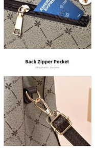 Close-up of back zipper pocket and gold metal ring hardware on the leather tote bag