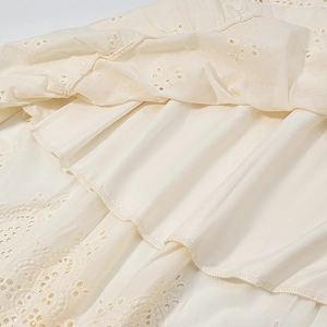 Detailed macro view of apricot lace embroidery hemline with high-quality inner lining