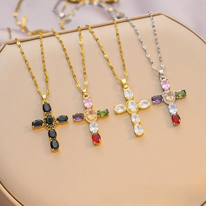 Detailed macro view of high-quality cross necklaces featuring diverse gemstone inlays