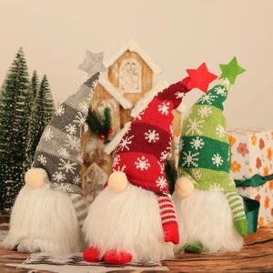 Three glowing Christmas gnomes with knitted hats and plush beards for holiday decor