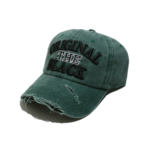 Detail of distressed edges and 3D embroidery on this vintage washed baseball cap