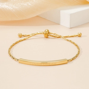 Adjustable gold titanium steel bracelet with Lover Dream engraved curved metal bar