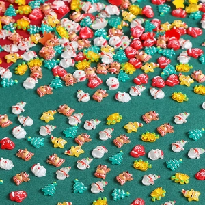 Mix of mini resin Christmas charms featuring Santa, reindeer and trees for DIY crafts