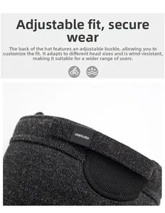 Detail of gray knitted hat featuring adjustable rear buckle for a secure and windproof fit