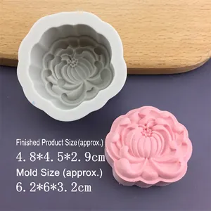 Macro detail of lotus flower silicone mold with finished pink clay sample for soap making