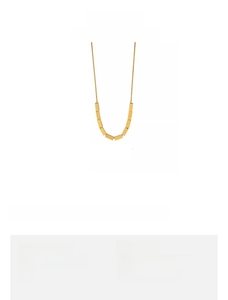 Detail view of 8g gold geometric pendant necklace made of copper with color retention