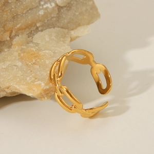18K gold plated stainless steel chunky chain open ring shown on a natural stone base