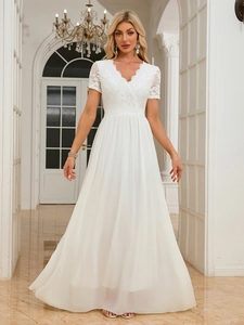 Detailed close-up of lace V-neck bodice and waistline of a white chiffon evening gown