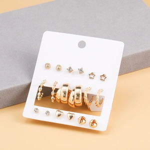 6-pair set of gold alloy earrings featuring studs and C-shaped hoops on a display card
