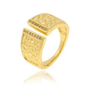 Detail of golden hammered open ring featuring sparkling micro-pave inset gemstones