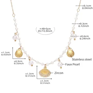 Detailed view of marine style gold stainless steel necklace with shell pendant and pearls