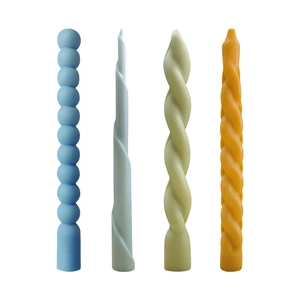 Spiral and beaded long column candles in blue, green, and orange for home decor
