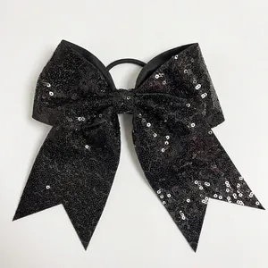 Detail of 8 inch large black sequined bow hair tie with high elastic rubber band