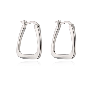 Detailed close-up of irregular silver-tone trapezoid geometric earrings with a polished finish