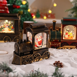 Detail of vintage Christmas train snow globe lanterns with LED lights and festive scenery