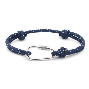 Close-up of a dark blue RPET rope bracelet with white dots and silver carabiner clasp