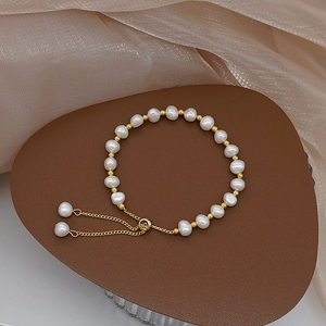 Exquisite freshwater pearl and gold bead bracelet with adjustable sliding drawstring closure