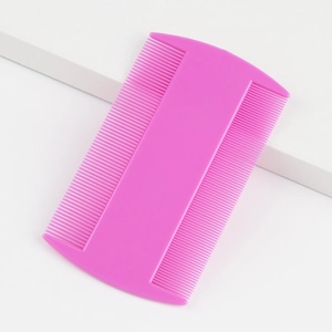 Dual-sided fine-tooth pet flea comb in purple plastic for grooming and cleaning hair