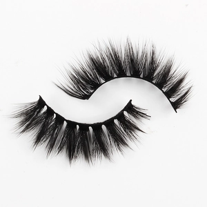 Detailed macro view of 3D faux mink false eyelashes with thick and long curly fibers