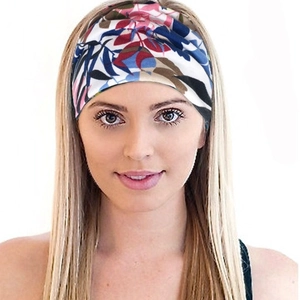 Bohemian floral stretch sport headband for women shown on model in a stylish look