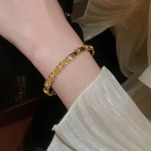 18k gold plated iris flower open bracelet with sparkling zircon accents on wrist