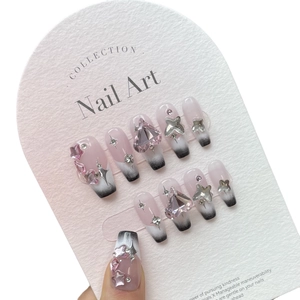 Pink and black gradient Y2K long coffin press-on nails with heart rhinestones and stars