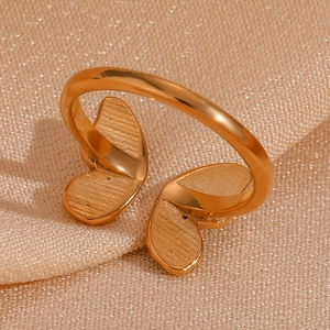Close-up of a gold-plated stainless steel butterfly open ring with zircon inlay