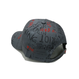 Detail of dark grey baseball cap with street style graffiti print and adjustable metal buckle