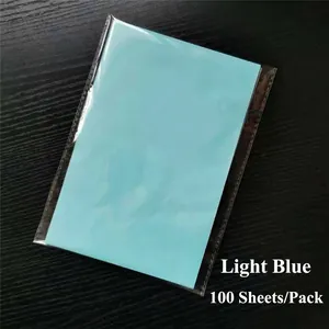 Detail of light blue A5 tissue paper pack of 100 sheets on a black wooden background