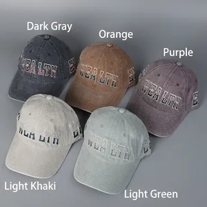 Washed vintage baseball caps with WEALTH embroidery in five distressed colors