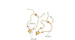 Detailed view of golden heart pendant bracelet with dimensions 25cm length and 1.1cm heart