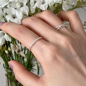 Minimalist 925 sterling silver twist and overlap rings set for women on hand with flowers