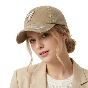 Vintage washed khaki baseball cap with number 7 embroidery and distressed brim detail