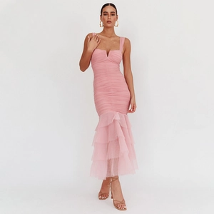 Pink bodycon mermaid dress with tiered mesh ruffles and spaghetti straps in studio