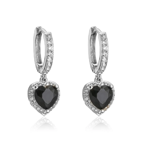 Detail of silver huggie hoop earrings with black heart stones and micro-pave setting