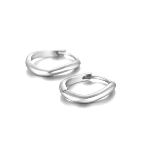 Detail view of silver S925 curved wave hoop earrings with a polished metallic finish
