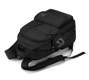 Detail view of the black multi-layer backpack with side hanging round coin pouch