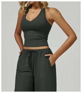 Detail view of side-profile dark gray sports set featuring halter neck top and drawstring pants