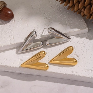 Minimalist 3D heart-shaped stud earrings in gold and silver with polished metallic finish