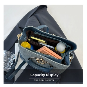 Top view showing large capacity interior of blue monogram bucket bag with daily essentials