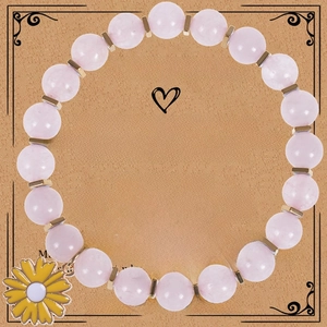 Pink zebra jasper beaded bracelet with yellow sunflower charm on a gift card