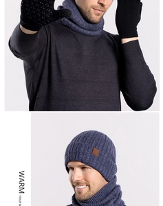 Close-up of winter knit beanie and scarf set with touchscreen gloves for cold protection