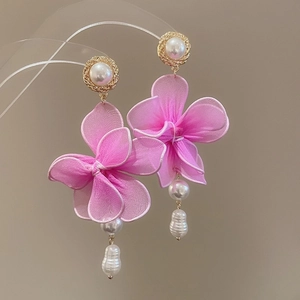 Detail of fabric flower earrings with baroque pearls and pink gauze petals