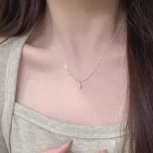 Minimalist S925 sterling silver ripple necklace with small water drop pendant on model neck